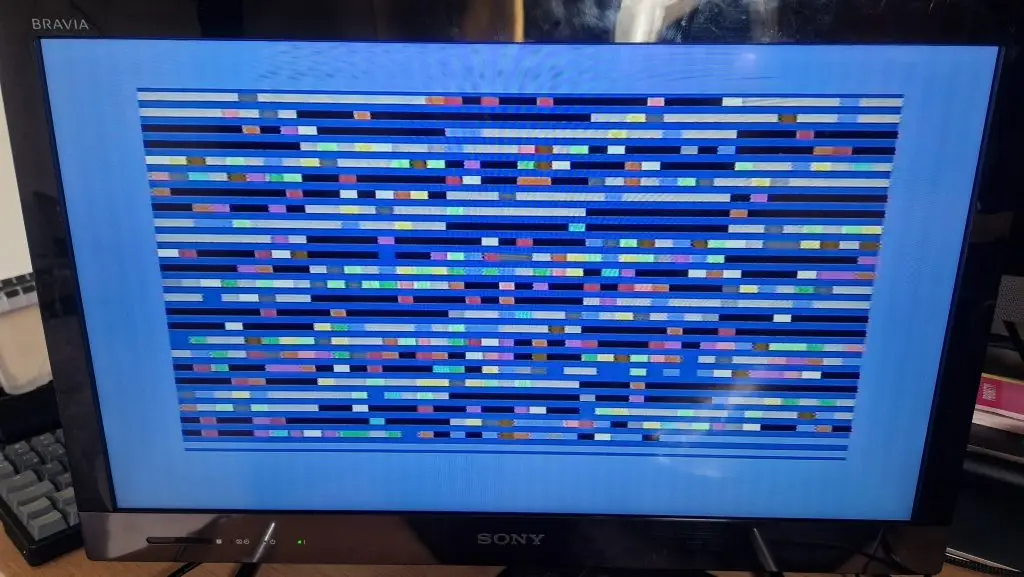 C64 screen showing rows of multi colour blocks on rows