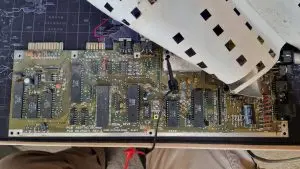 A C64C short board motherboard which is quite dirty.