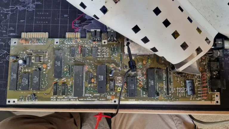 A C64C short board motherboard which is quite dirty.