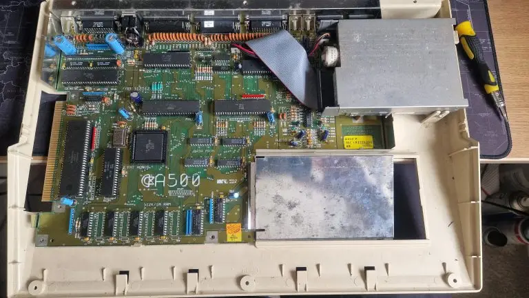 A picture taken of a Commodore Amiga 500 rev 6 motherboard.