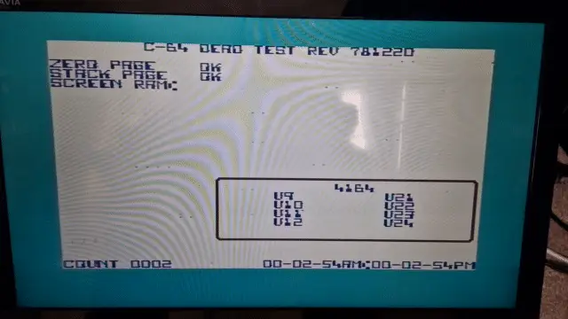 A C64 screen display that shows random dots appearing over the screen as a problem to be fixed.