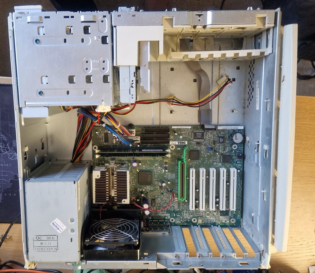 Inside shot of a Dell Dimension 4100 showing the processor board and drive cages